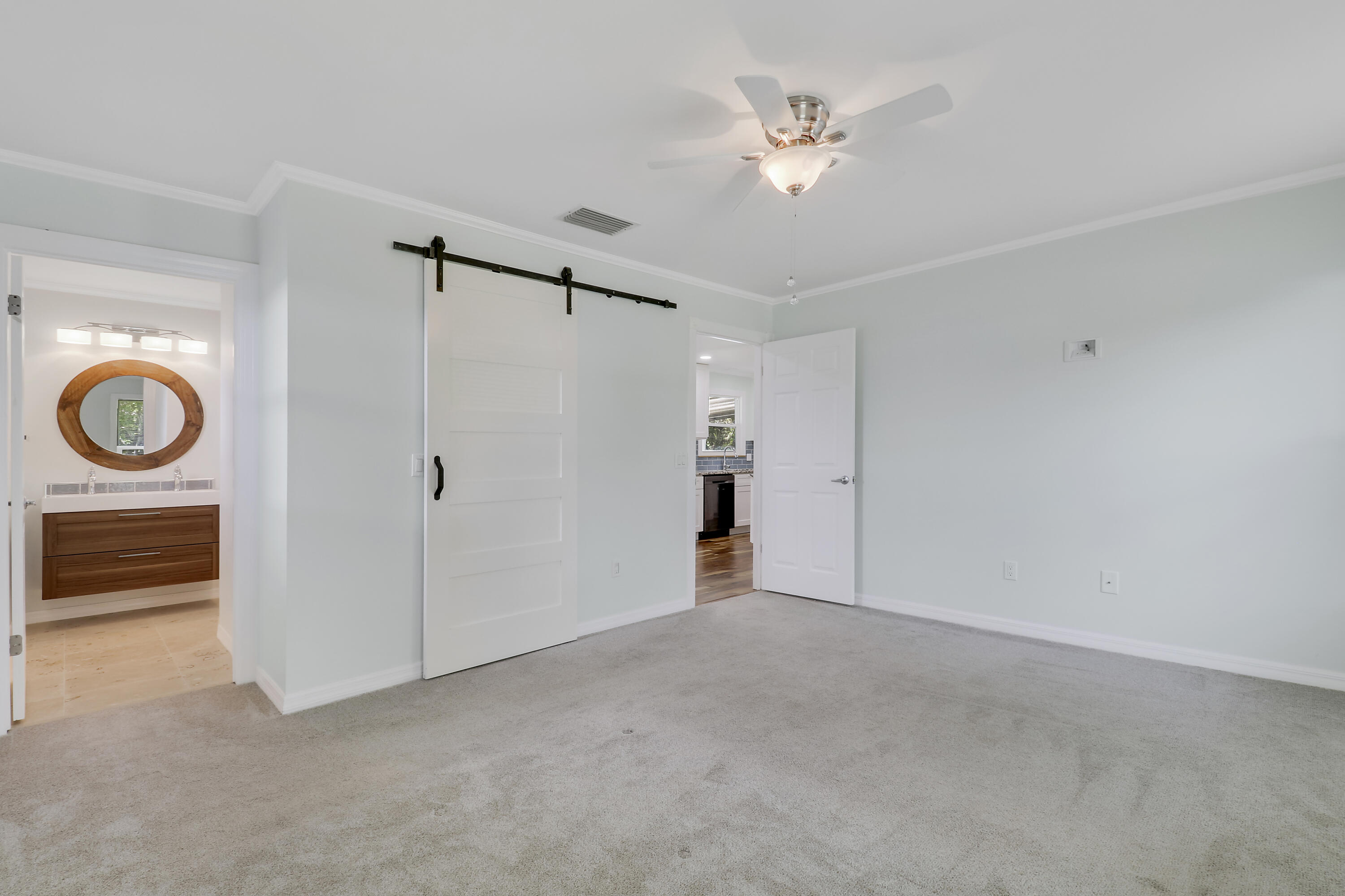 5909 Seagrape Drive Fort Pierce, FL 34982 - Photo 15 of 27 a view of empty room with ceiling fan and fan