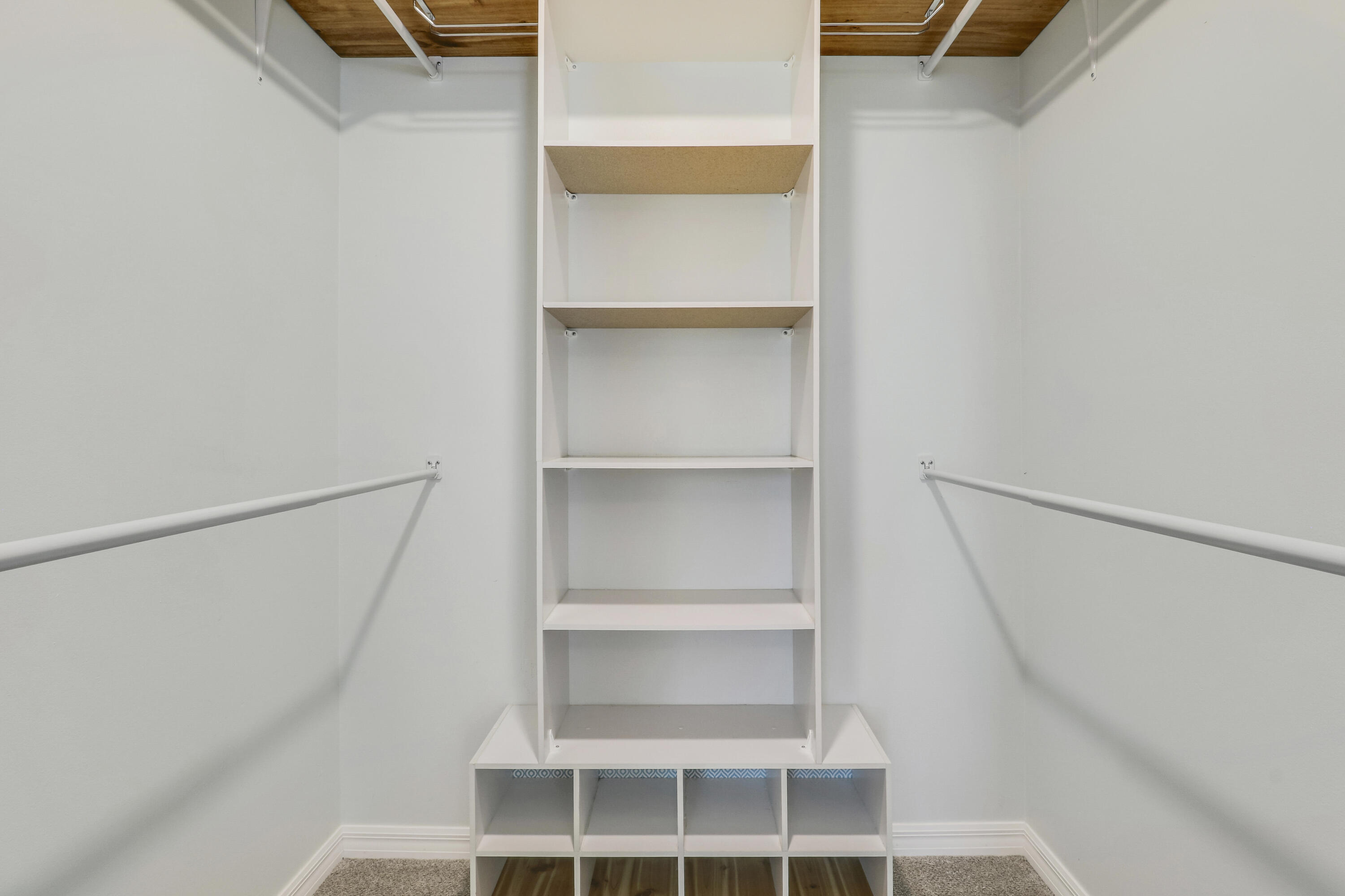 5909 Seagrape Drive Fort Pierce, FL 34982 - Photo 18 of 27 a view of walk in closet with empty racks