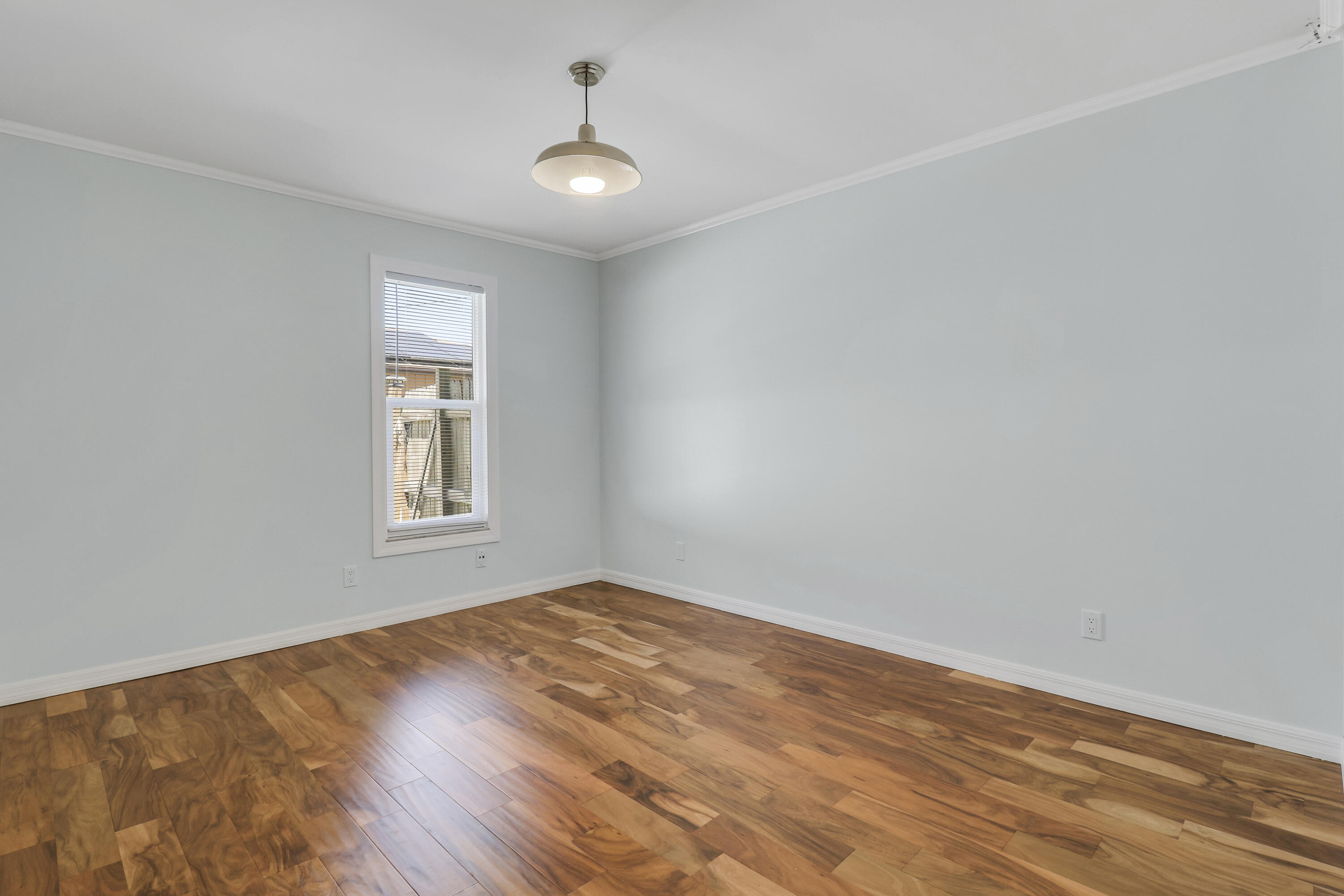 5909 Seagrape Drive Fort Pierce, FL 34982 - Photo 20 of 27 wooden floor in an empty room with a window