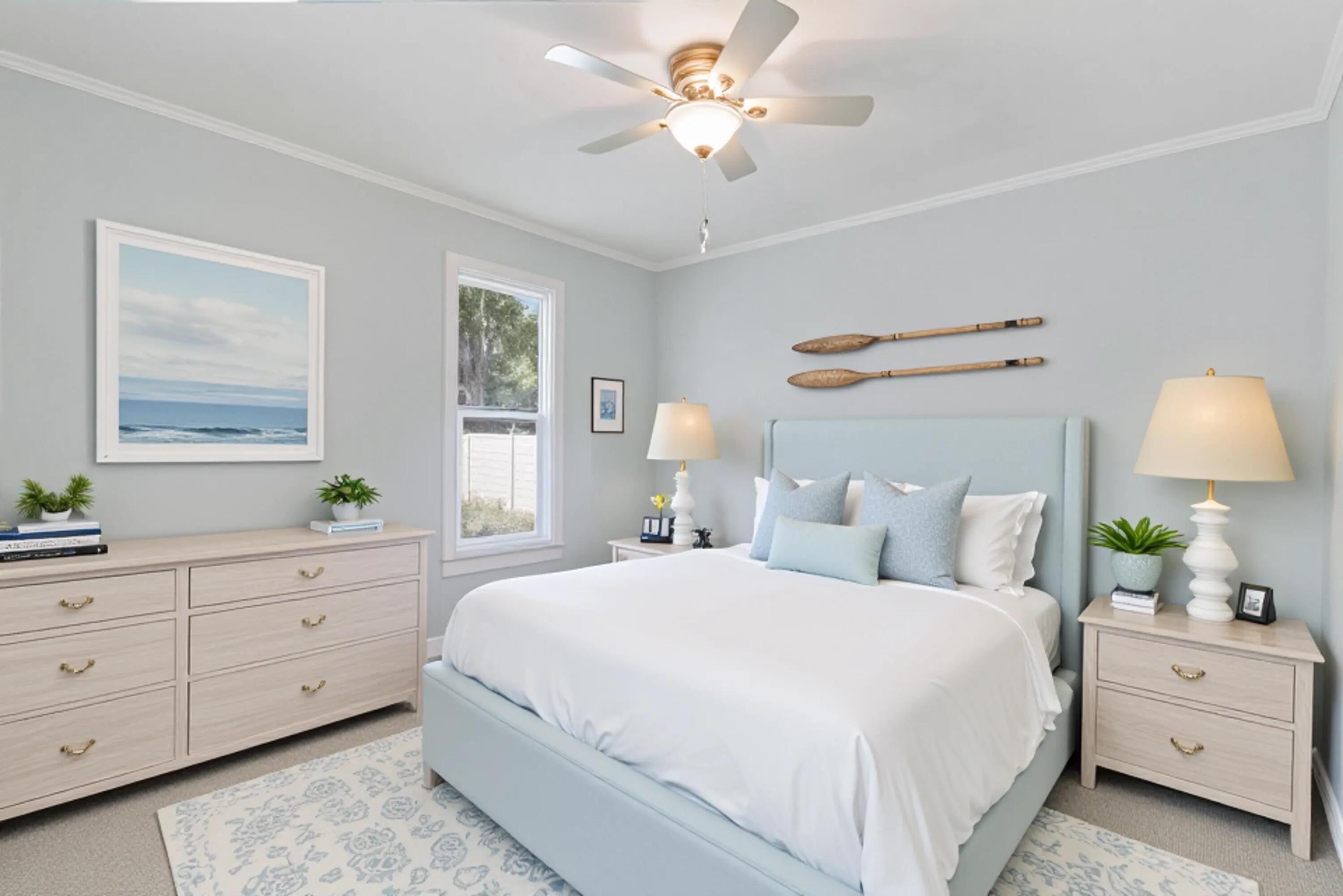 5909 Seagrape Drive Fort Pierce, FL 34982 - Photo 21 of 27 a bedroom with a bed and a window dresser