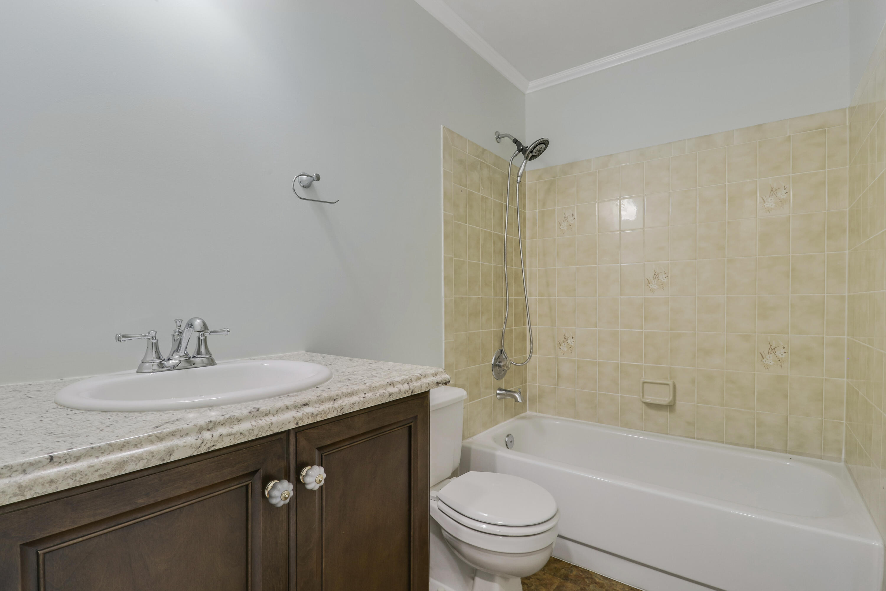 5909 Seagrape Drive Fort Pierce, FL 34982 - Photo 23 of 27 a bathroom with a granite countertop sink toilet and shower