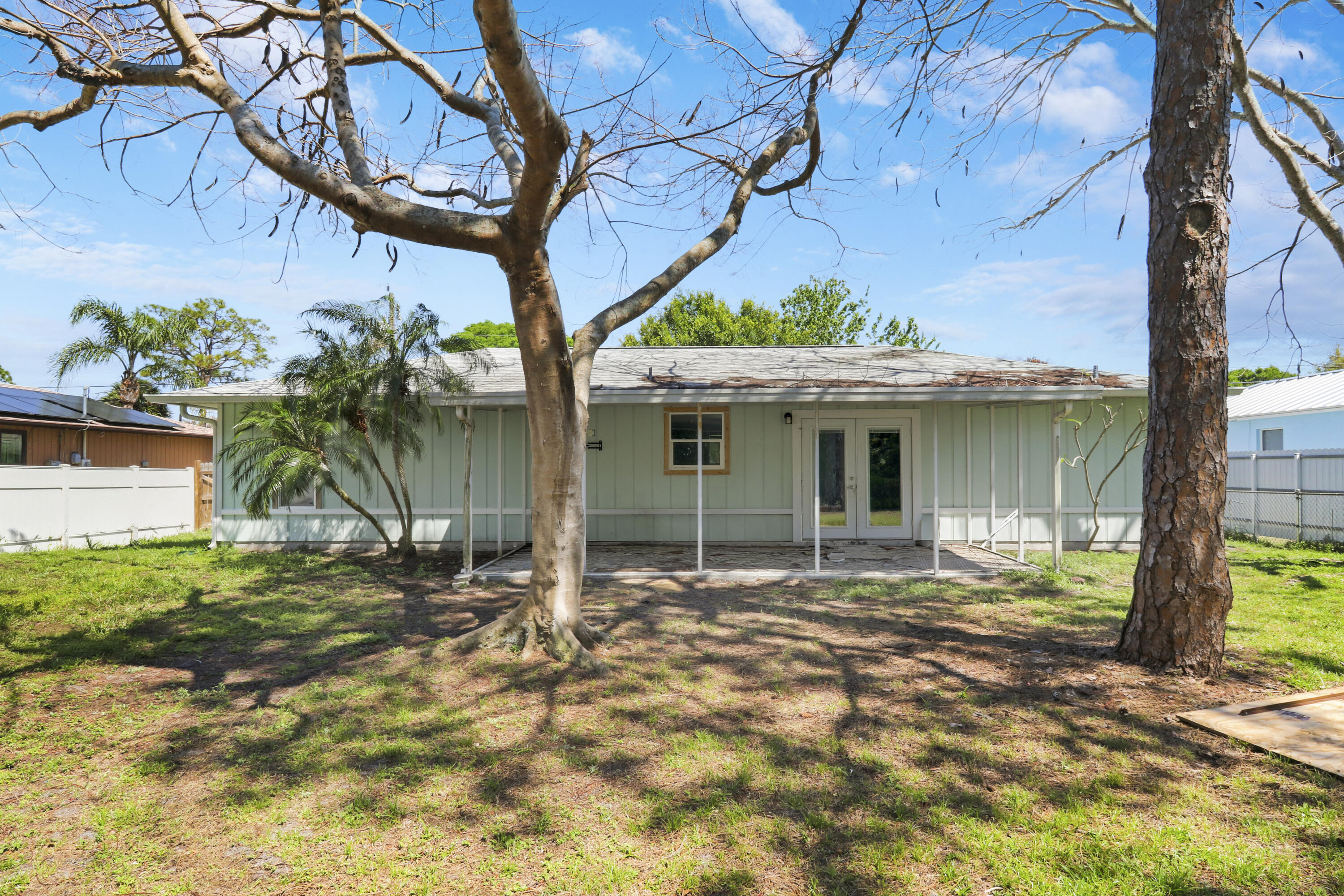 5909 Seagrape Drive Fort Pierce, FL 34982 - Photo 26 of 27 a front view of a house with garden