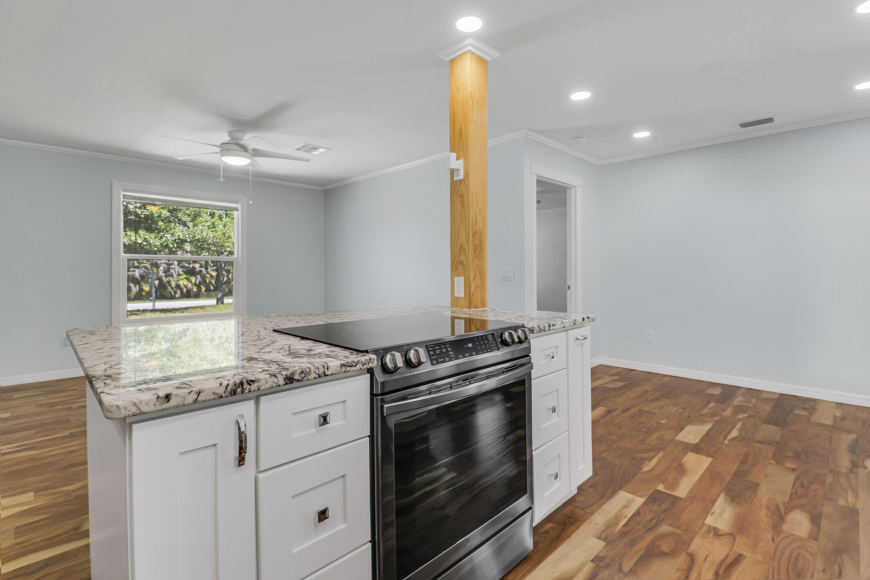 5909 Seagrape Drive Fort Pierce, FL 34982 - Photo 7 of 27 a kitchen with granite countertop a stove and a sink