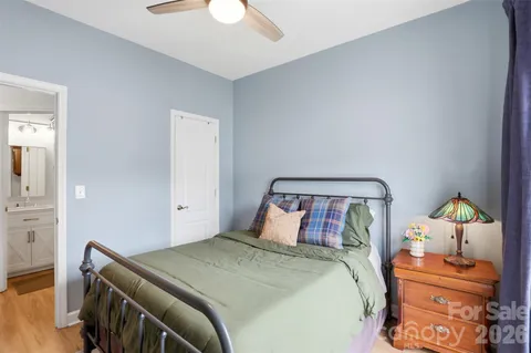 a bedroom with a bed and dresser