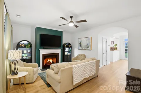 a living room with furniture fireplace and a flat screen tv