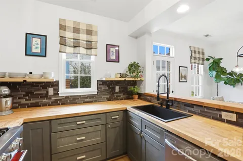 a kitchen with a sink and a large window