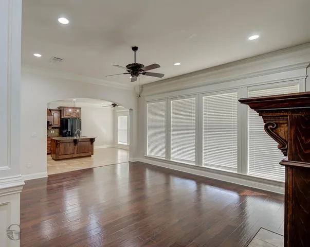 a view of livingroom with hardwood floor and a ceiling fan