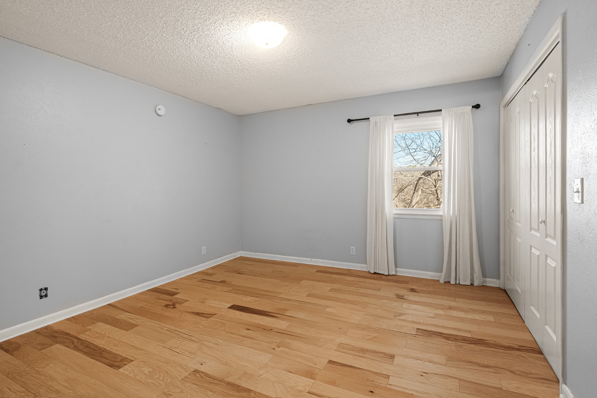 21 Vaughns Gap Road, Unit 23 Nashville, TN 37205 - Photo 12 of 25 a view of empty room with wooden floor