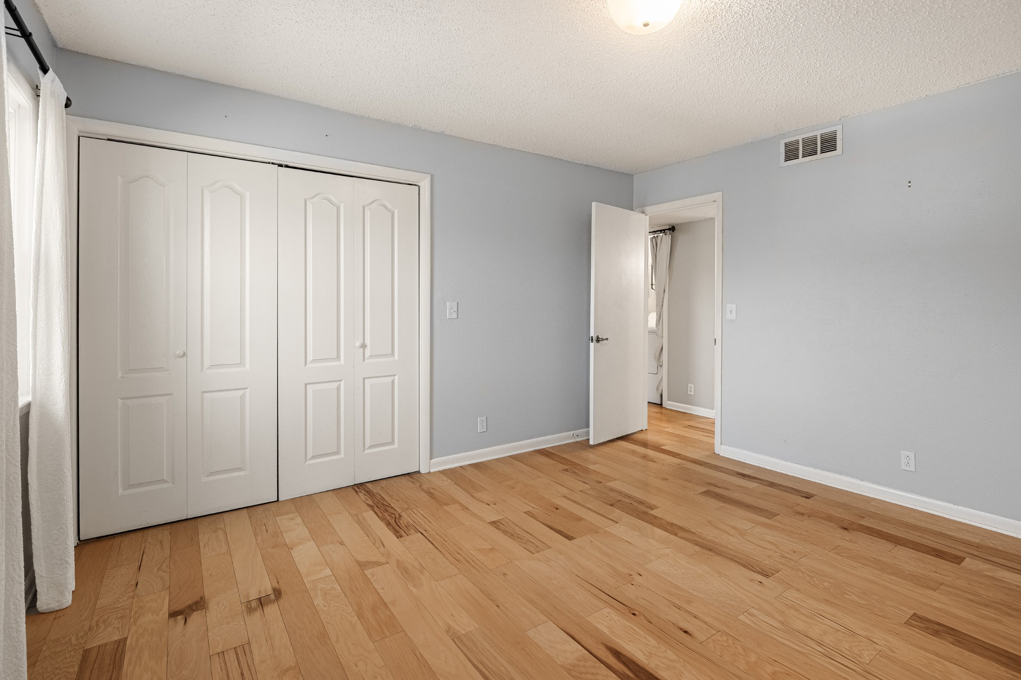 21 Vaughns Gap Road, Unit 23 Nashville, TN 37205 - Photo 13 of 25 a view of empty room with wooden floor