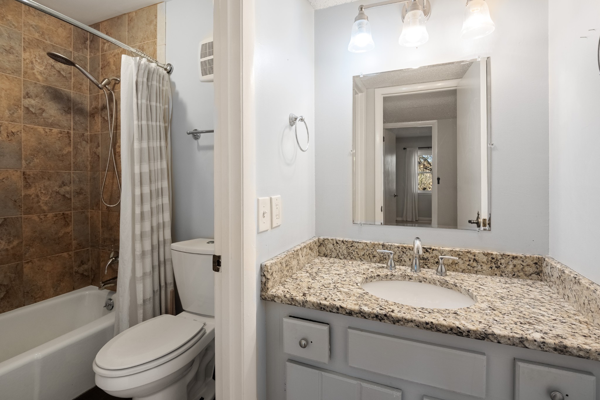 21 Vaughns Gap Road, Unit 23 Nashville, TN 37205 - Photo 14 of 25 a bathroom with a granite countertop sink toilet and shower