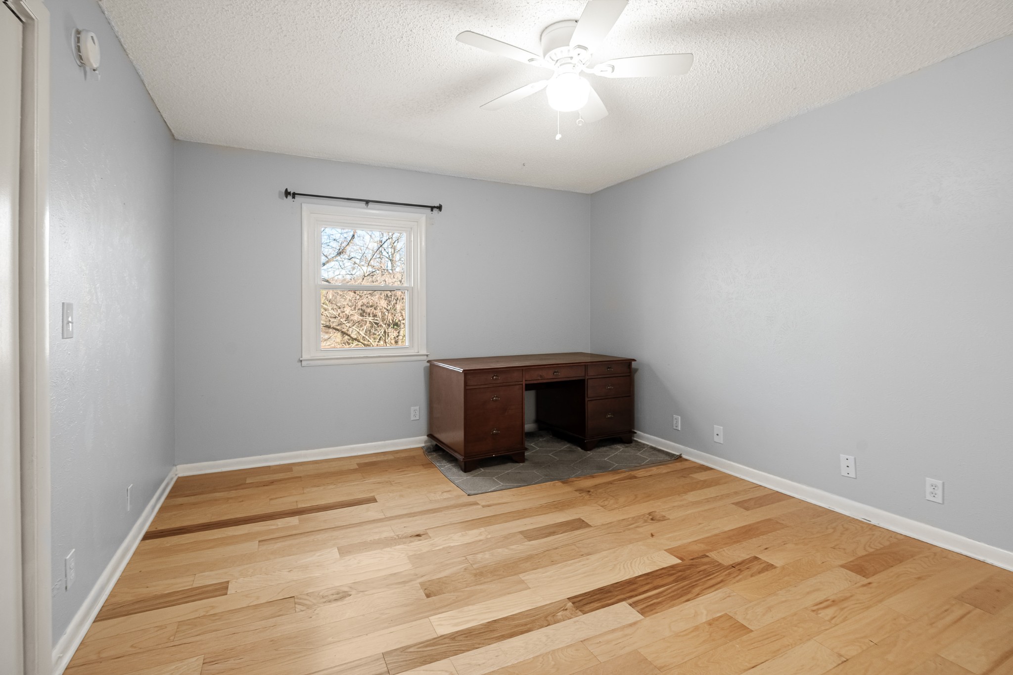 21 Vaughns Gap Road, Unit 23 Nashville, TN 37205 - Photo 17 of 25 an empty room with a window and ceiling fan
