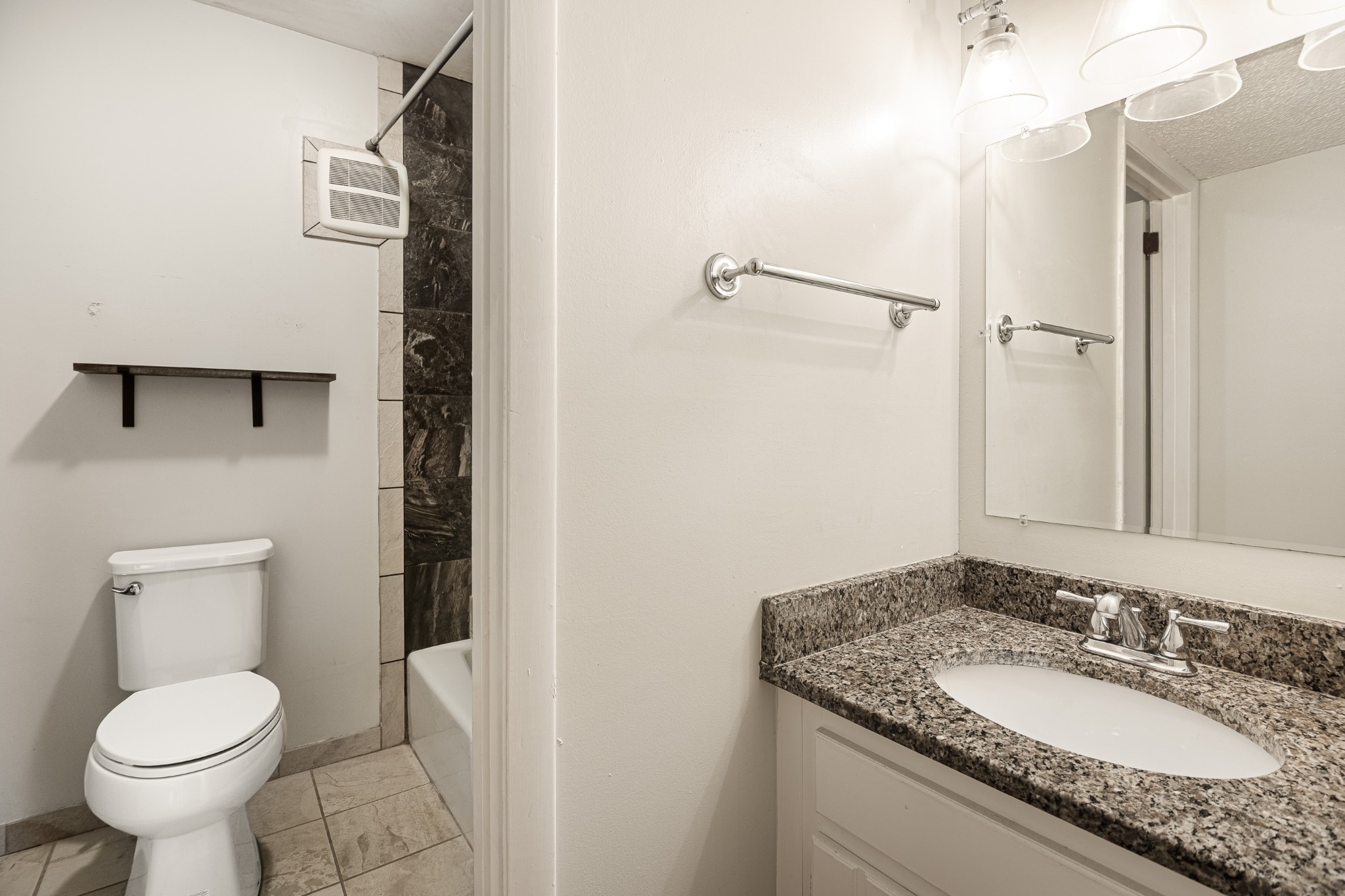 21 Vaughns Gap Road, Unit 23 Nashville, TN 37205 - Photo 22 of 25 a bathroom with a granite countertop toilet sink and mirror