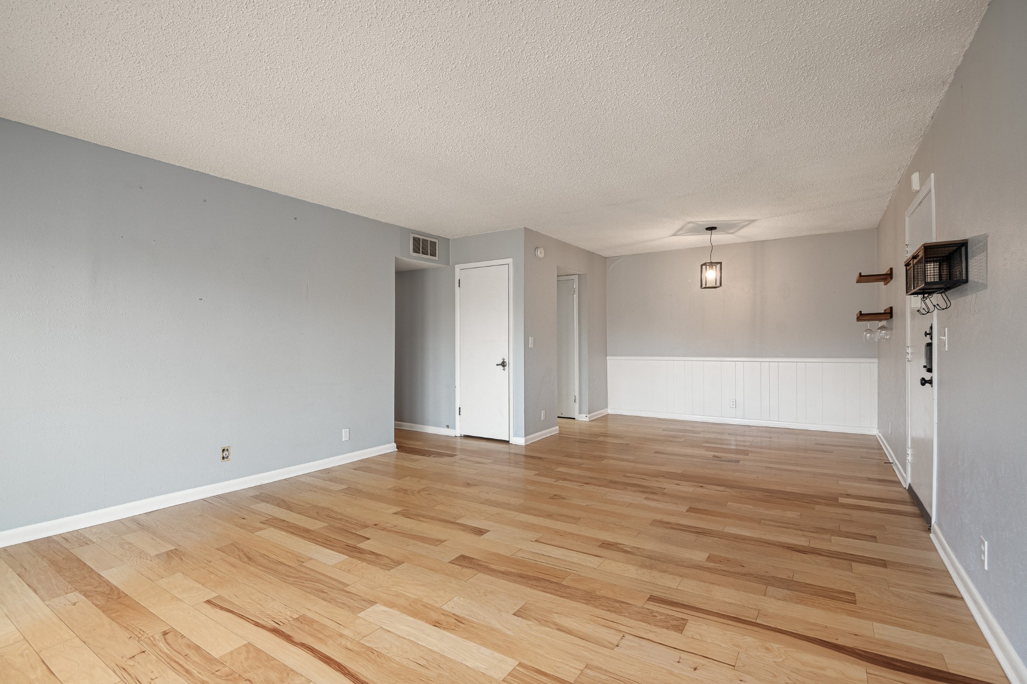 21 Vaughns Gap Road, Unit 23 Nashville, TN 37205 - Photo 7 of 25 a view of empty room with wooden floor