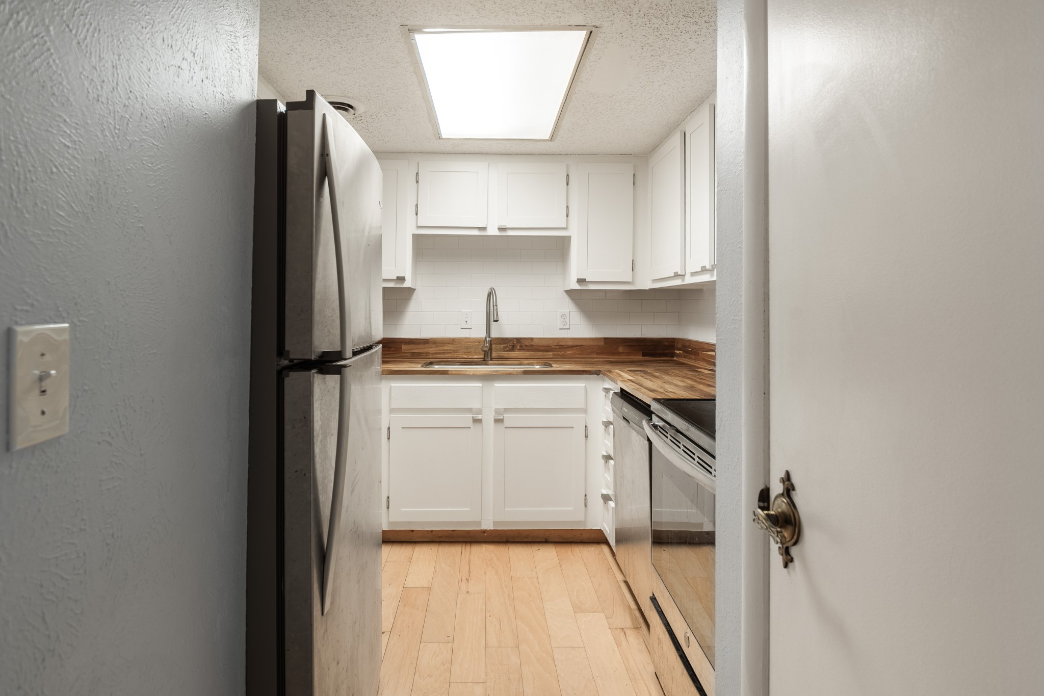 21 Vaughns Gap Road, Unit 23 Nashville, TN 37205 - Photo 10 of 25 a kitchen with a refrigerator and a sink