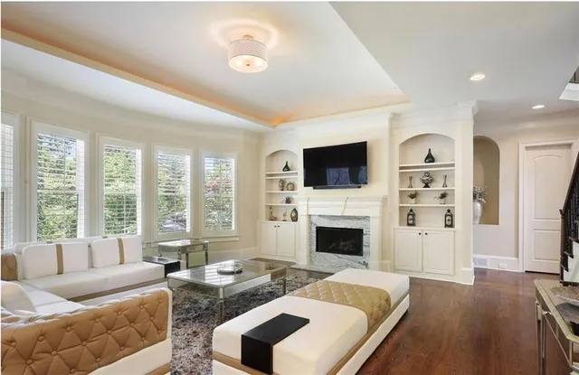 a kitchen with stainless steel appliances granite countertop a sink a stove a dining table and chairs