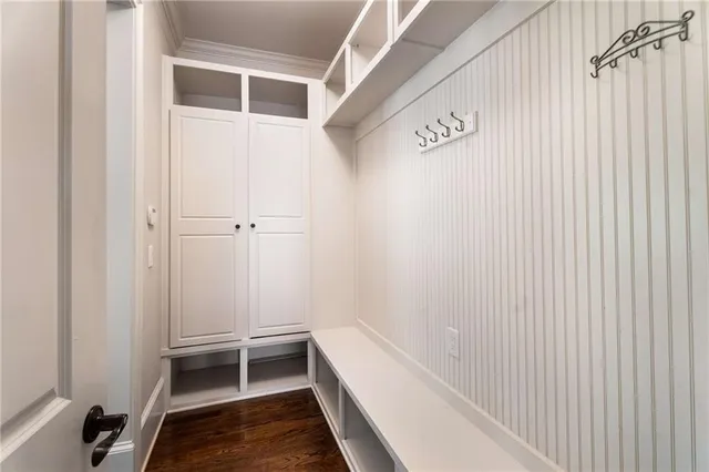 a dining room with furniture and chandelier