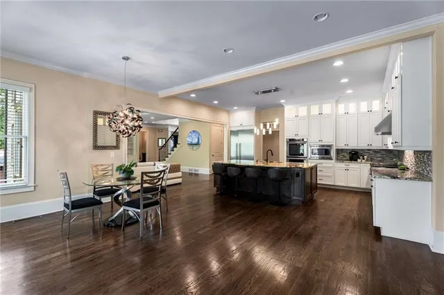 a living room with furniture or couch and a wooden floor