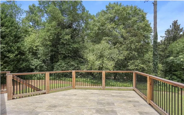 a spacious bathroom with a double vanity sink a mirror and a bathtub