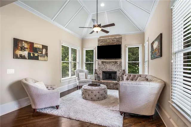 a bedroom with a bed and a ceiling fan