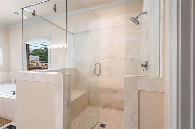 a front view of a house with a yard and plants