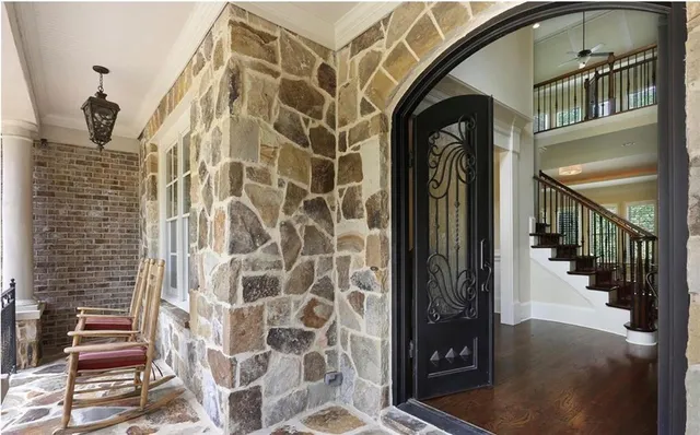 a living room with fireplace furniture and a flat screen tv