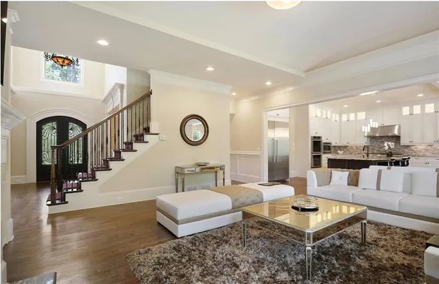 a kitchen with stainless steel appliances granite countertop a stove refrigerator and cabinets