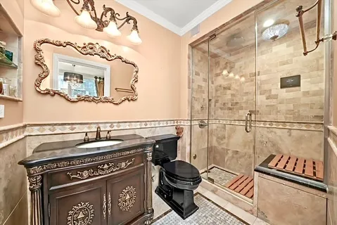 a bathroom with a stove a mirror and a sink