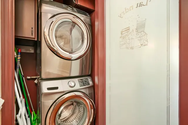 a view of a storage & utility room with dryer and washer