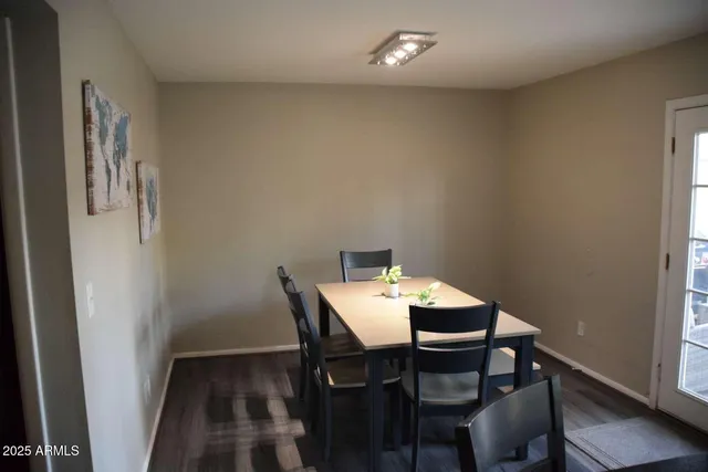 a bed room with a bed furniture and a flat tv screen