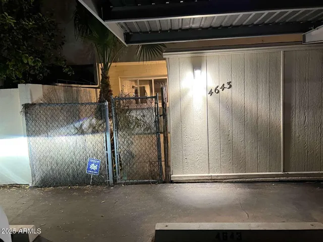 a view of a backyard with sitting area