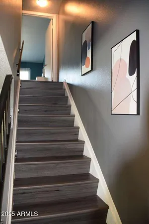 a bathroom with a sink a toilet and shower curtain