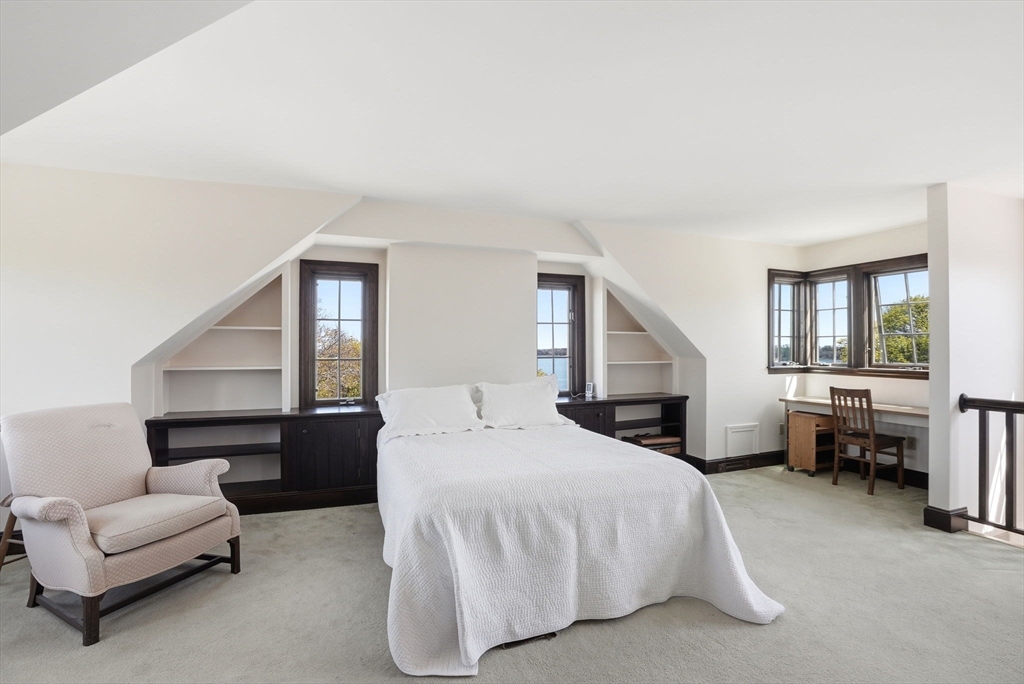 34 Governor Long Road Hingham, MA 02043 - Photo 14 of 37 a spacious bedroom with a bed couch and windows