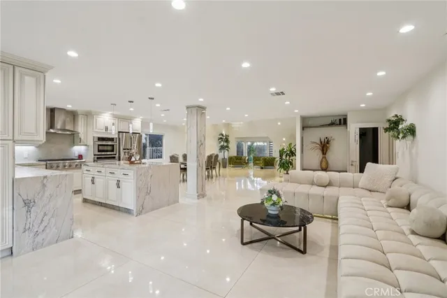 a dining room with furniture and entryway