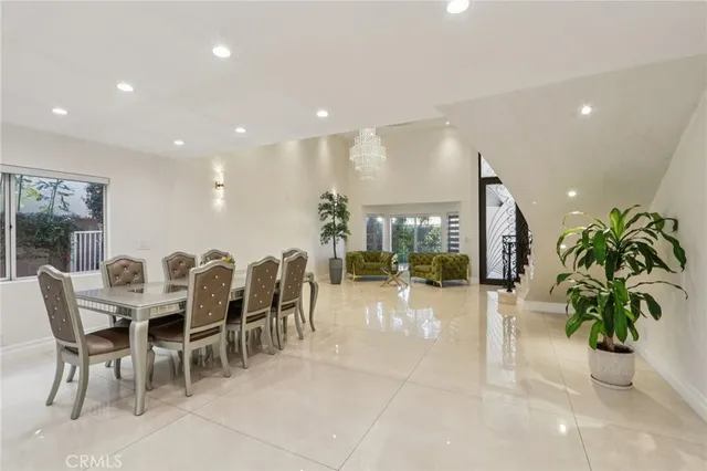 a kitchen with stainless steel appliances granite countertop a sink and a stove