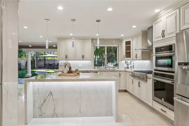 a spacious bedroom with a bed and wooden floor