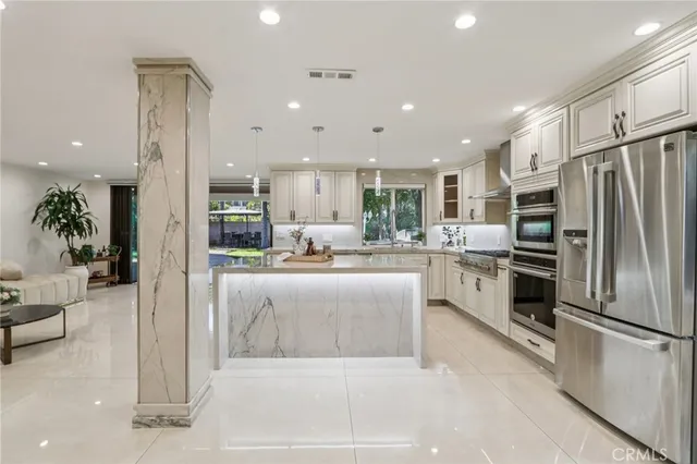 a bedroom with a bed and a wooden floor