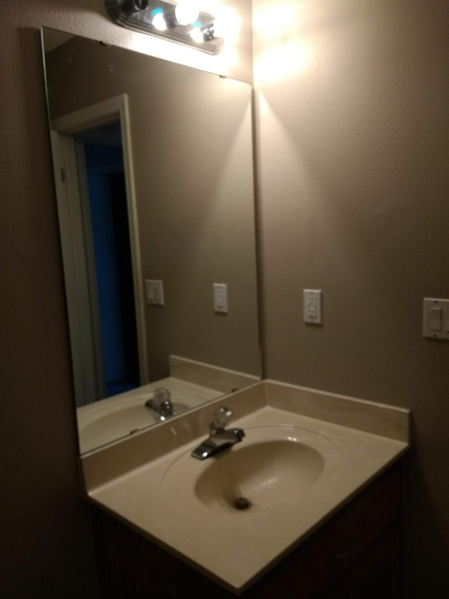 801 Cloverview Drive Crestview, FL 32536 - Photo 16 of 28 a bathroom with a sink and a mirror