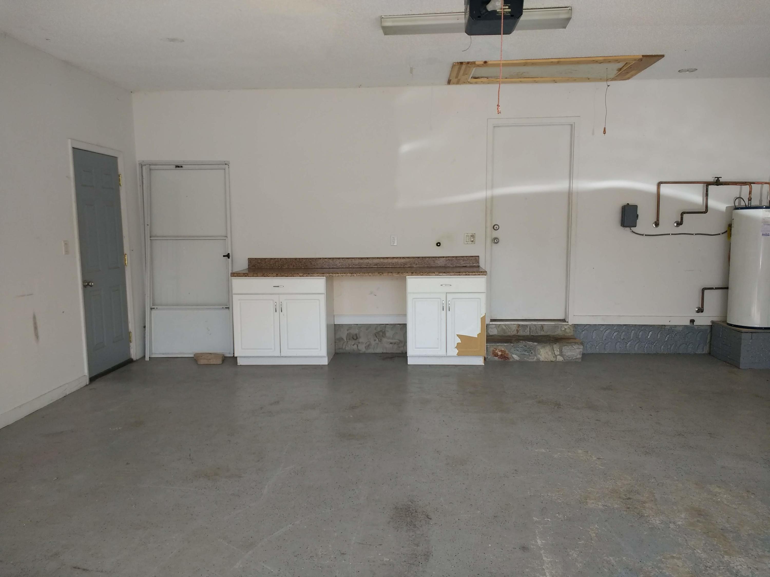 801 Cloverview Drive Crestview, FL 32536 - Photo 20 of 28 a view of a kitchen with refrigerator and cabinets