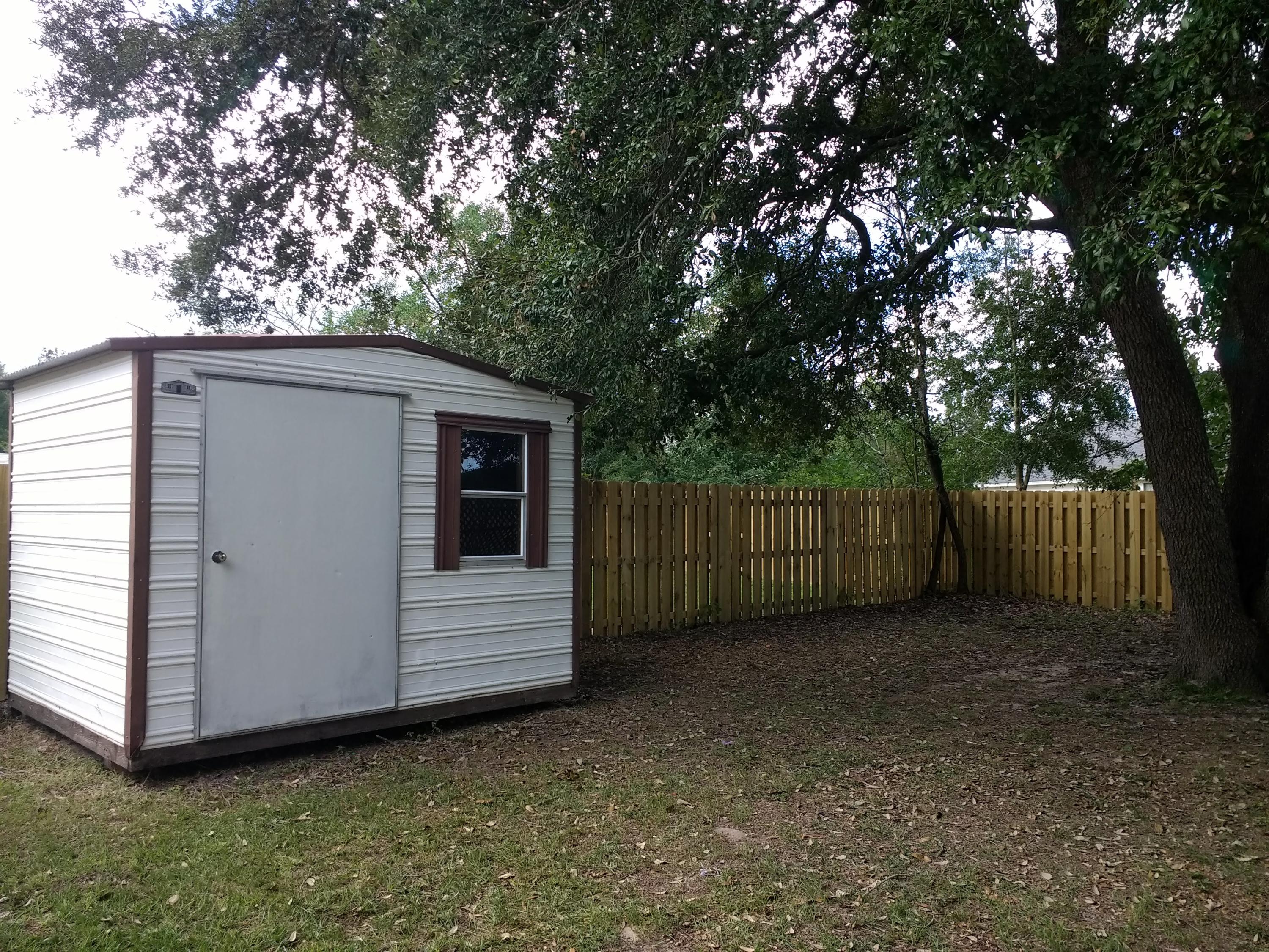 801 Cloverview Drive Crestview, FL 32536 - Photo 23 of 28 a view of backyard and tree