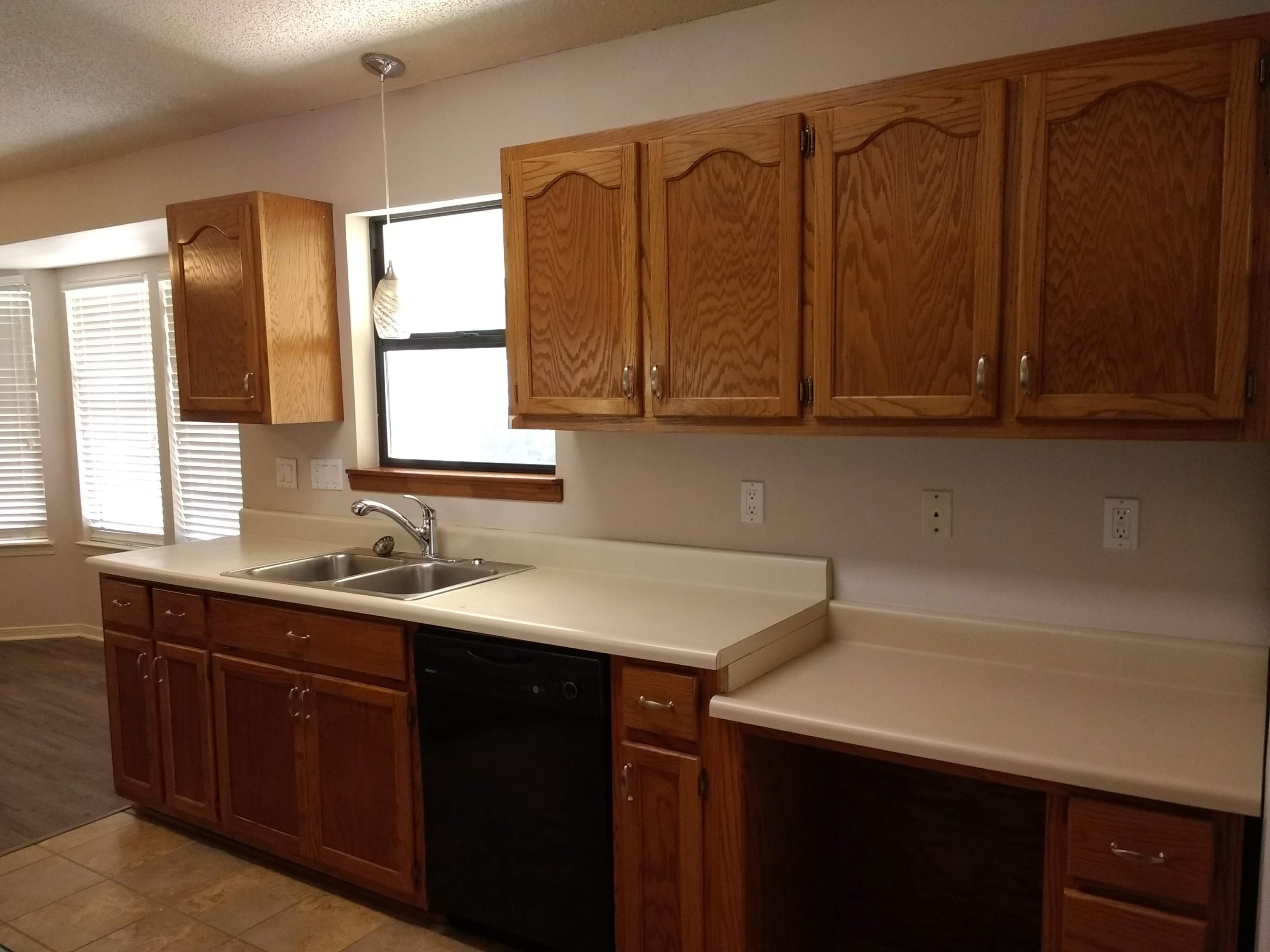 801 Cloverview Drive Crestview, FL 32536 - Photo 6 of 28 a kitchen with a sink cabinets and window