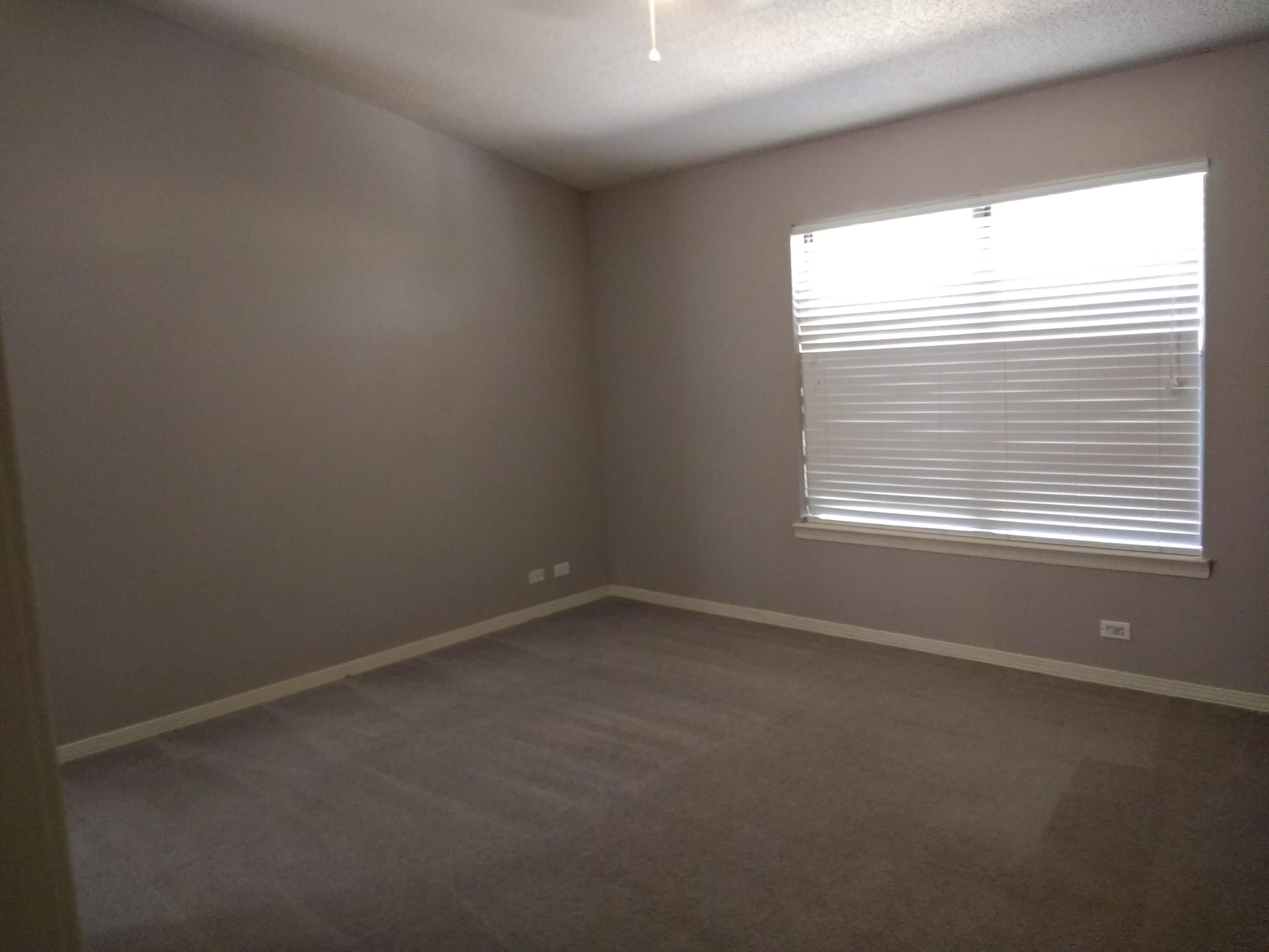 801 Cloverview Drive Crestview, FL 32536 - Photo 9 of 28 an empty room with a window