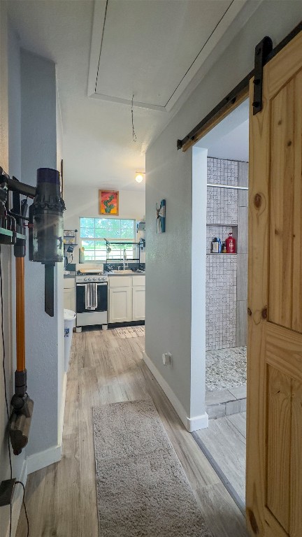 1014 Private Road 4041 Dime Box, TX 77853 - Photo 12 of 30 a kitchen with kitchen island stainless steel appliances a stove refrigerator and cabinets