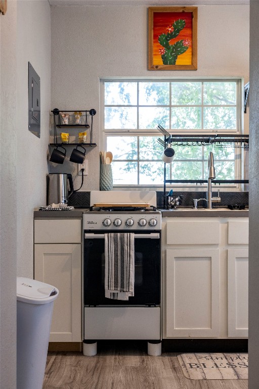 1014 Private Road 4041 Dime Box, TX 77853 - Photo 2 of 30 a kitchen with stainless steel appliances a stove a white cabinet and a window