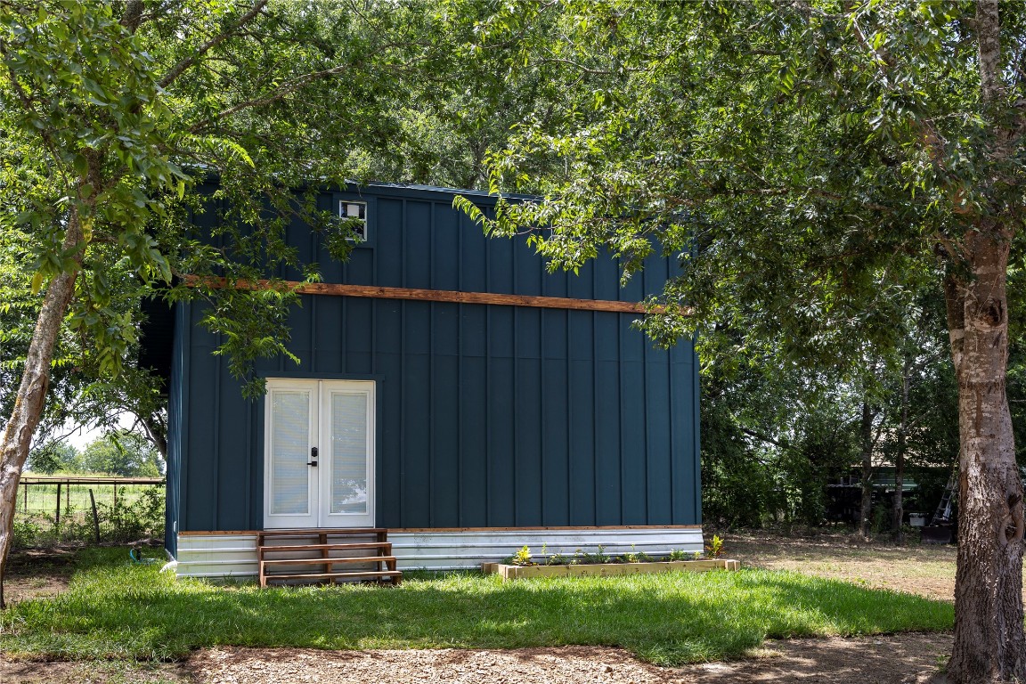 1014 Private Road 4041 Dime Box, TX 77853 - Photo 24 of 30 a view of house with backyard and a garden