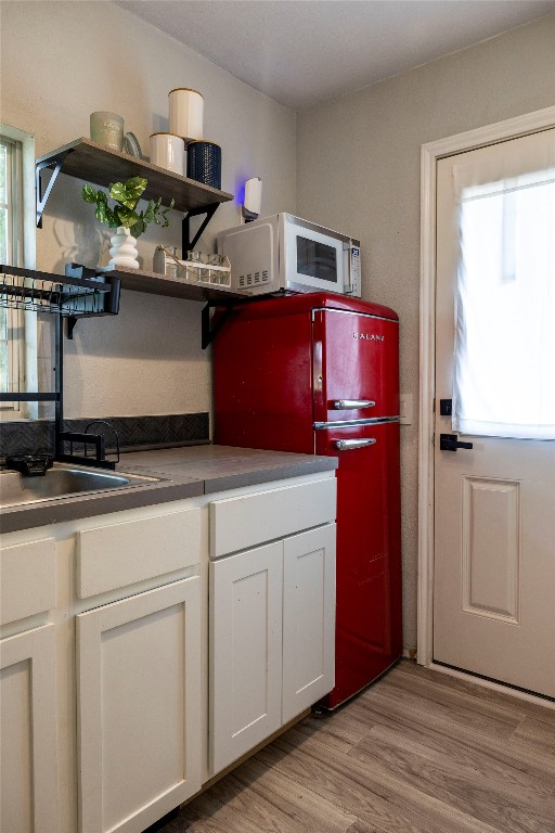 1014 Private Road 4041 Dime Box, TX 77853 - Photo 5 of 30 a kitchen with stainless steel appliances granite countertop a sink stove and refrigerator