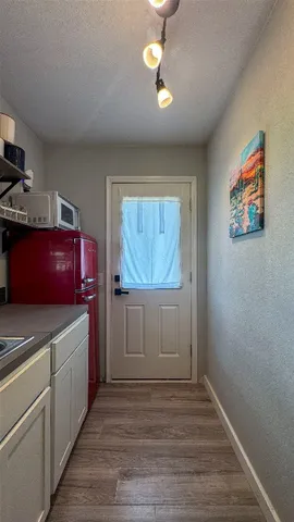 a view of cabinets and wooden floor