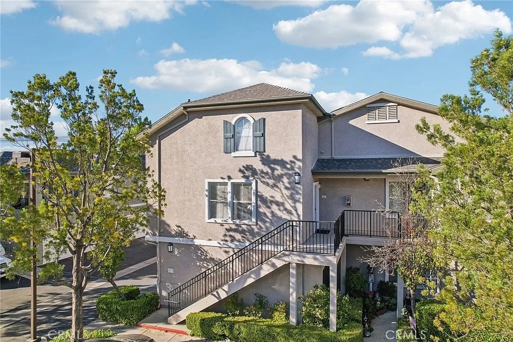 20000 Plum Canyon Road, Unit 225 Saugus, CA 91350 - Photo 1 of 12 a front view of a house with garden