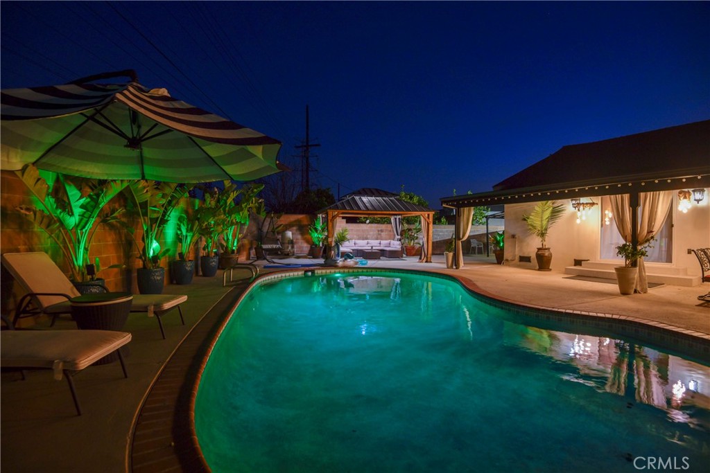 9728 Rhea Avenue Northridge, CA 91324 - Photo 35 of 36 a view of a swimming pool with a patio