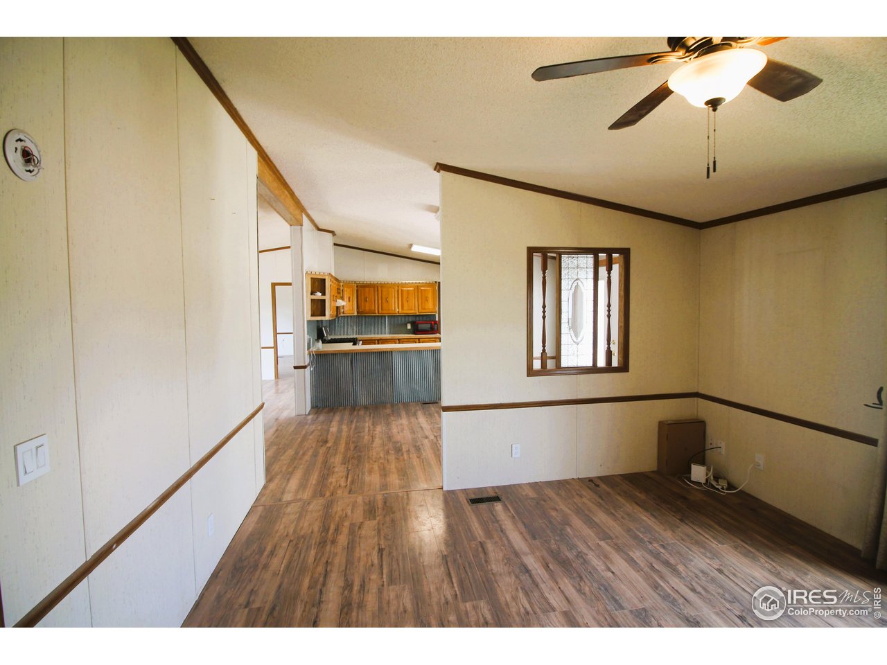 22354 County Road 41 Sterling, CO 80751 - Photo 35 of 40 a view interior of a house wooden floor windows and a chandelier fan
