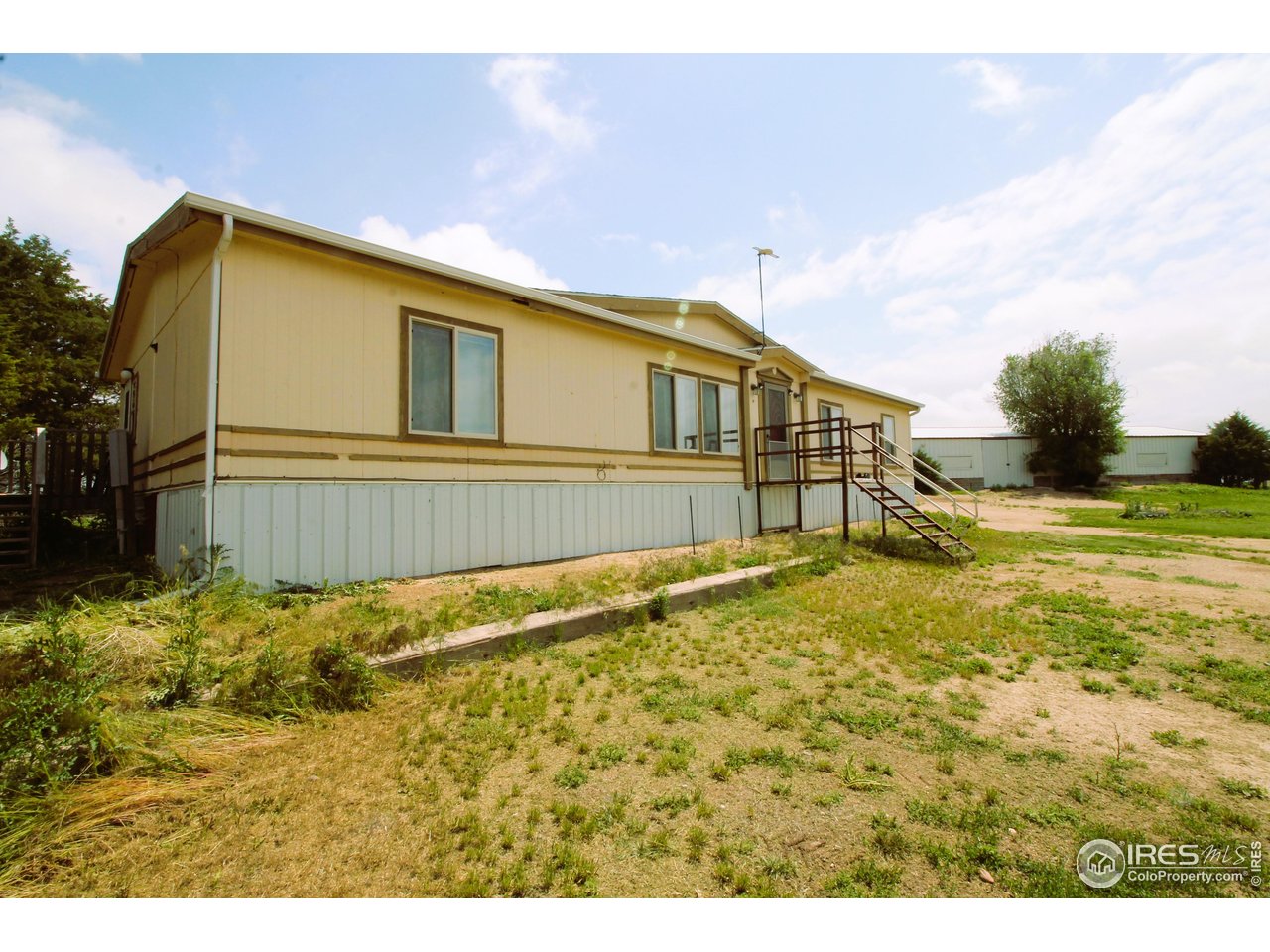 22354 County Road 41 Sterling, CO 80751 - Photo 6 of 40 a view of a house with a backyard